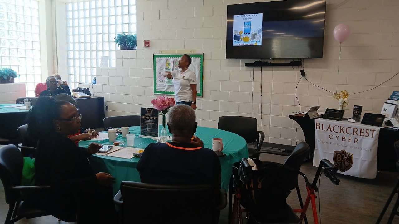 Facilitator engaging community members during a Shielded in Dignity® cyber-safety session in Maryland.